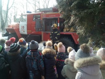 ​На большой машине красной